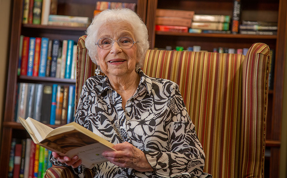 The library at Somerset Lodge with shelves of books and comfortable seating