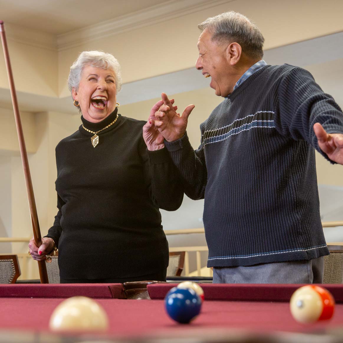 Residents playing billiards at Somerset Lodge